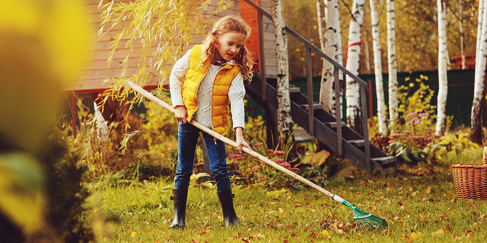 child raking leaves Wallace's Garden Center